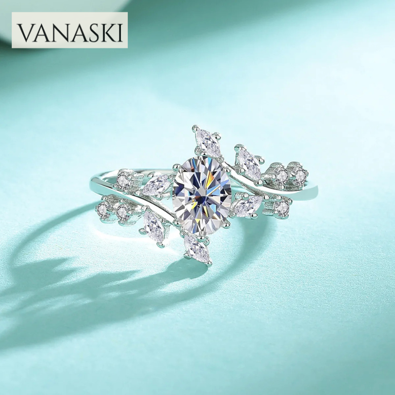 Silver ring with a large diamond on a light blue background, featuring the Vanaski brand.