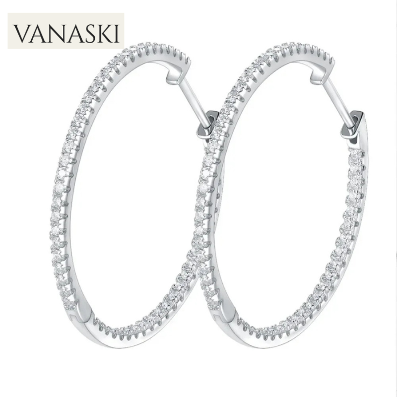 Silver hoop earrings with clear stones on a white background, featuring the Vanaski brand.