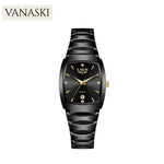 Black wristwatch with gold accents on a white background, featuring the brand 'VANASKI'.