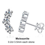 Silver earrings with Moissanite stones on a white background