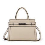 Beige handbag with black hardware on a white background