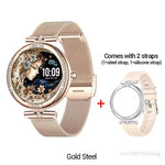 Gold steel smartwatch with additional silicone strap on a white background