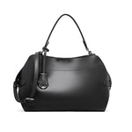 Black handbag with a shoulder strap on a white background