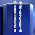 Diamond earrings on a blue jewelry box