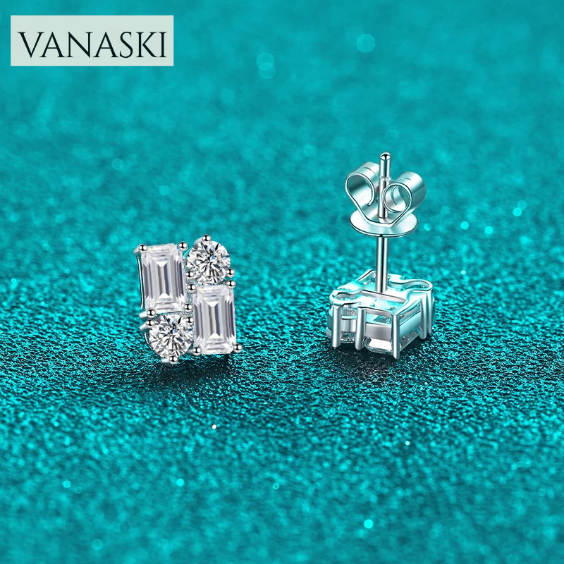 Silver earrings with gemstones on a teal background, featuring the Vanaski brand.
