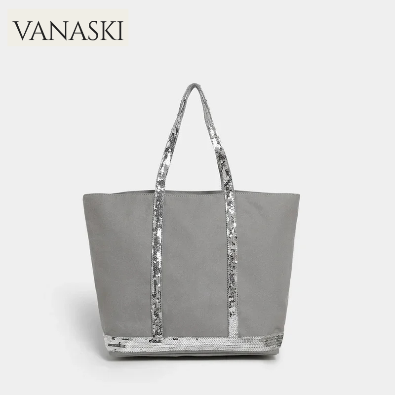 Gray tote bag with sequin handle on a white background, featuring the Vanaski brand.