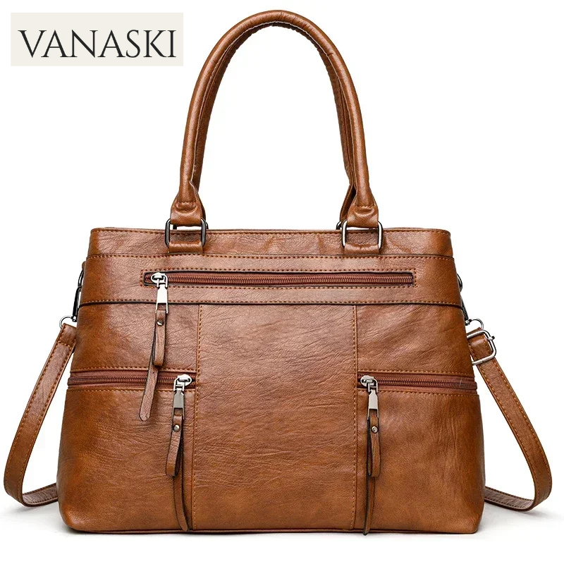 Brown handbag with shoulder strap on a white background, featuring the Vanaski brand.