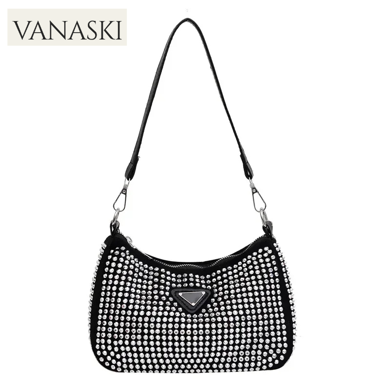 Black handbag with rhinestone details on a white background, featuring the Vanaski brand.
