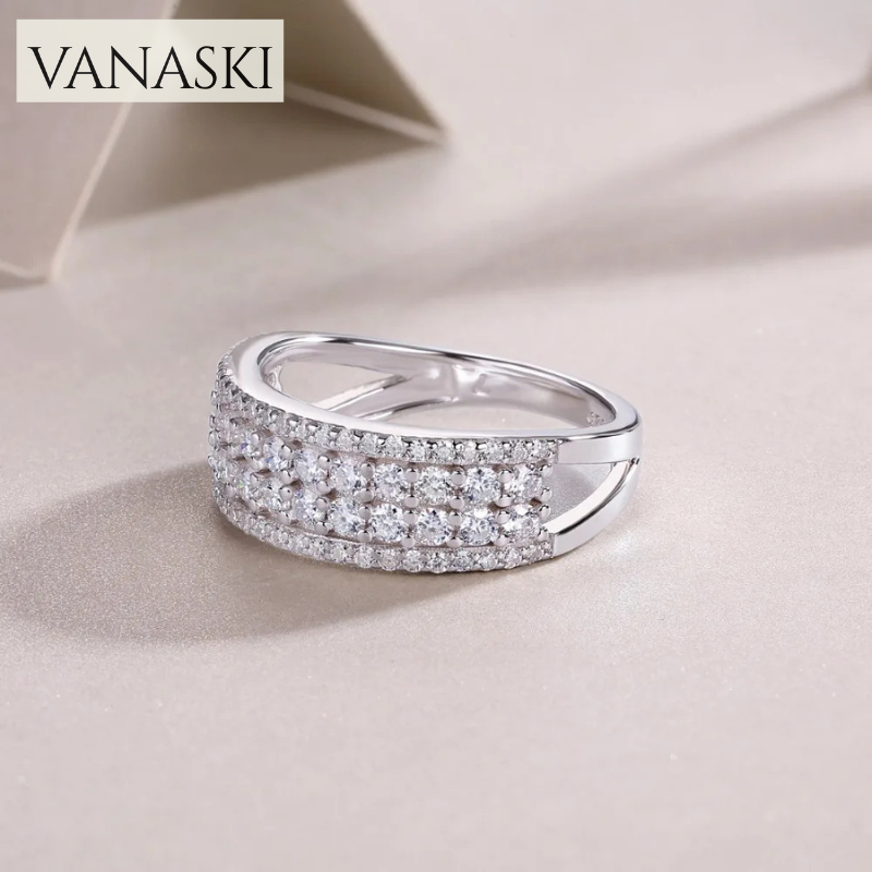 Silver ring with diamonds on a light beige background, featuring the VANASKI brand.