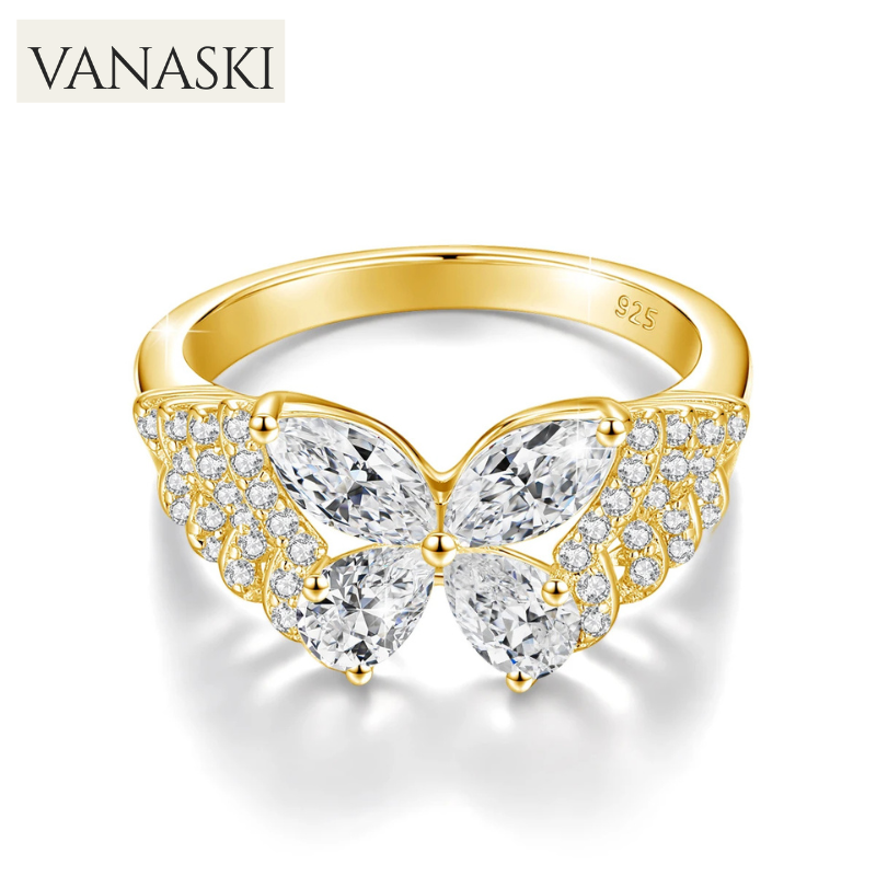 Gold butterfly ring with clear gemstones on a white background, featuring the Vanaski brand.