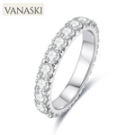 Silver ring with clear gemstones on a white background, featuring the Vanaski brand.