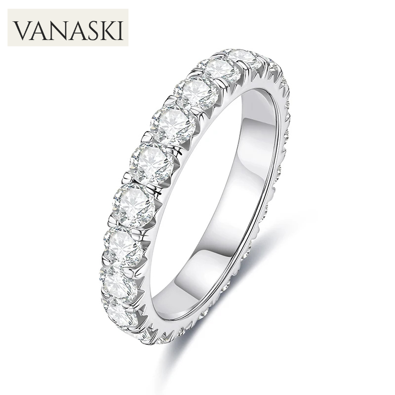 Silver ring with clear gemstones on a white background, featuring the Vanaski brand.