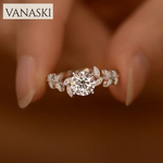 Silver ring with diamond on a blurred background, featuring the Vanaski brand.