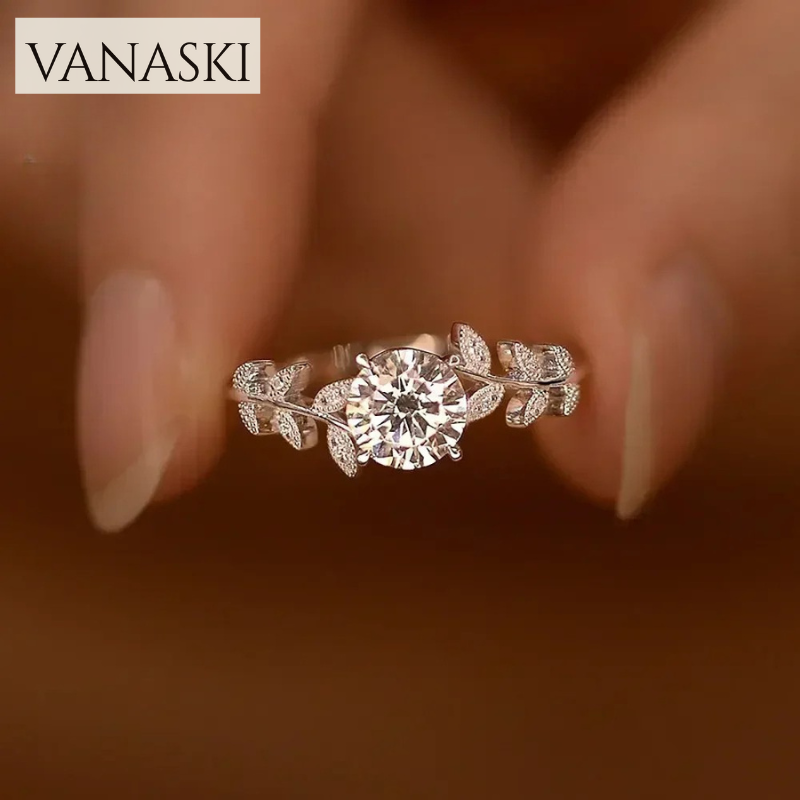 Silver ring with diamond on a blurred background, featuring the Vanaski brand.