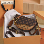 Brown patterned handbag in a Vanaski branded box