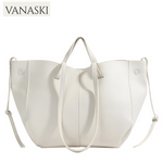 White tote bag with shoulder strap on a white background, featuring the Vanaski brand.