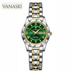 Vanaski watch with green dial and gold accents on a white background