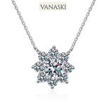 Snowflake-shaped pendant necklace with Vanaski branding on a white background