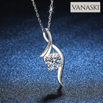 Silver necklace with a diamond pendant on a dark blue background, featuring the Vanaski brand.