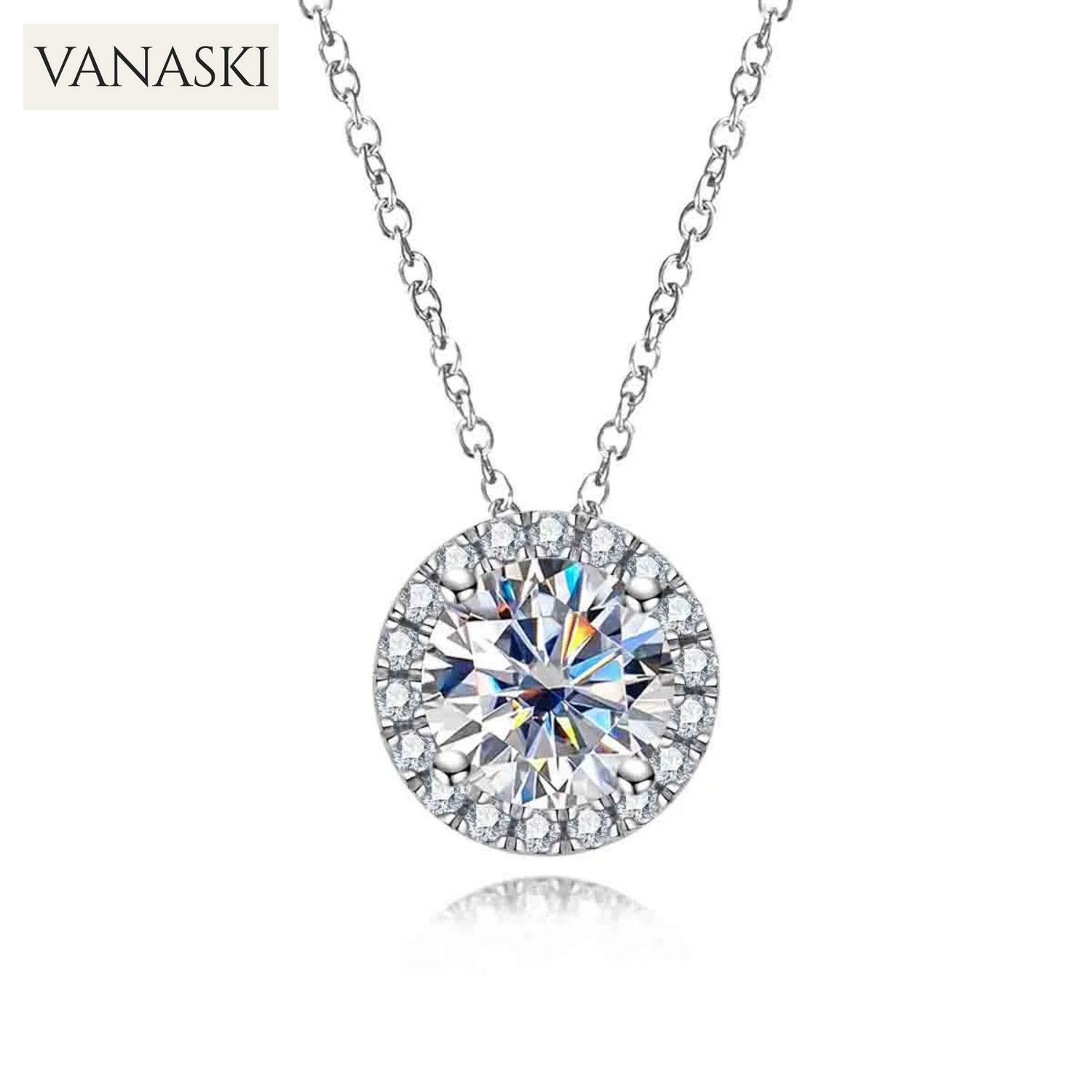 Silver necklace with a round, clear gemstone pendant on a white background, featuring the Vanaski brand.