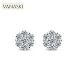 Silver earrings with clear gemstones on a white background, featuring the Vanaski brand.