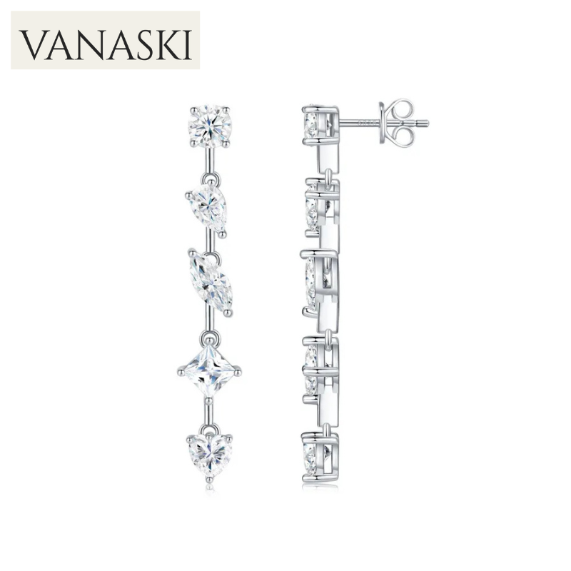 Silver earrings with clear stones on a white background, featuring the Vanaski brand.