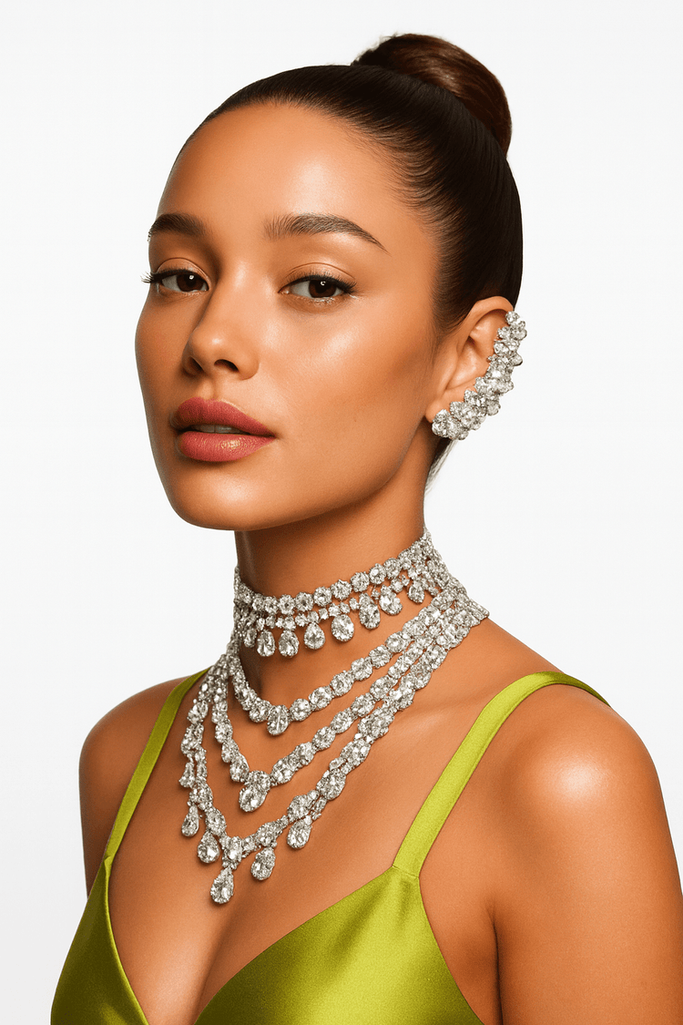 Woman wearing a luxurious diamond necklace and earrings on a plain background