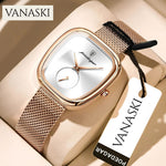 Gold watch with mesh band on a beige surface, featuring the Vanaski brand.