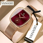 Gold watch with red face and mesh band on a beige surface, featuring the Vanaski brand.