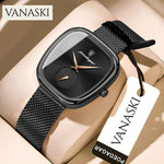 Black wristwatch with mesh band on a beige surface, featuring the VANASKI brand.
