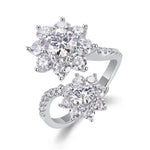 Silver ring with multiple gemstones on a white background