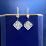 Diamond earrings on a blue background
