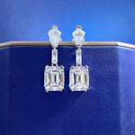 Diamond earrings on a blue background