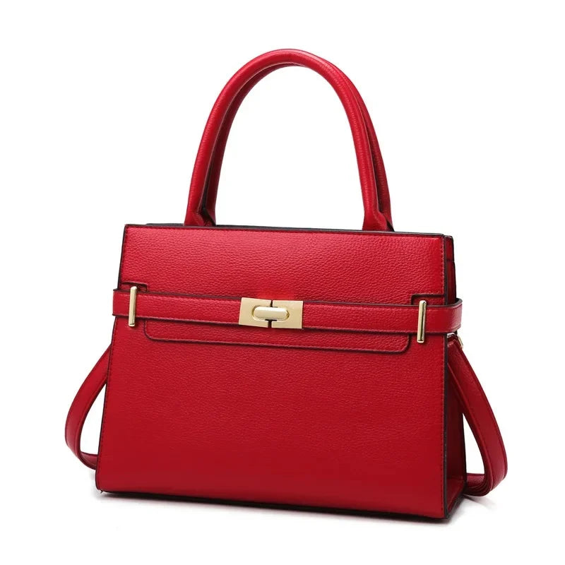 Red handbag with a gold clasp on a white background