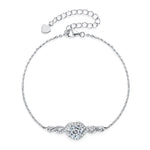 Silver bracelet with a heart clasp on a white background