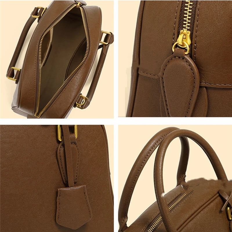 Brown handbag with gold zipper and handle on a beige background
