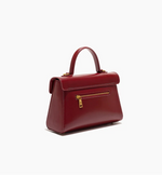 Red handbag with gold zipper on a white background