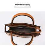Brown handbag with open interior on a white background