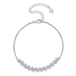 Silver bracelet with clear stones on a white background