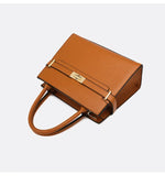 Brown handbag with gold accents on a white background