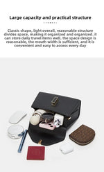 Black makeup bag with various items on a white background