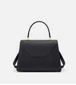 Black handbag with gold accents on a white background