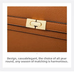 Brown leather handbag with gold clasp on a white background