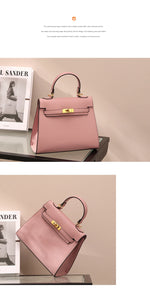 Pink handbag with gold hardware on a beige surface, with a magazine in the background.