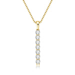 Gold necklace with a diamond pendant on a white background