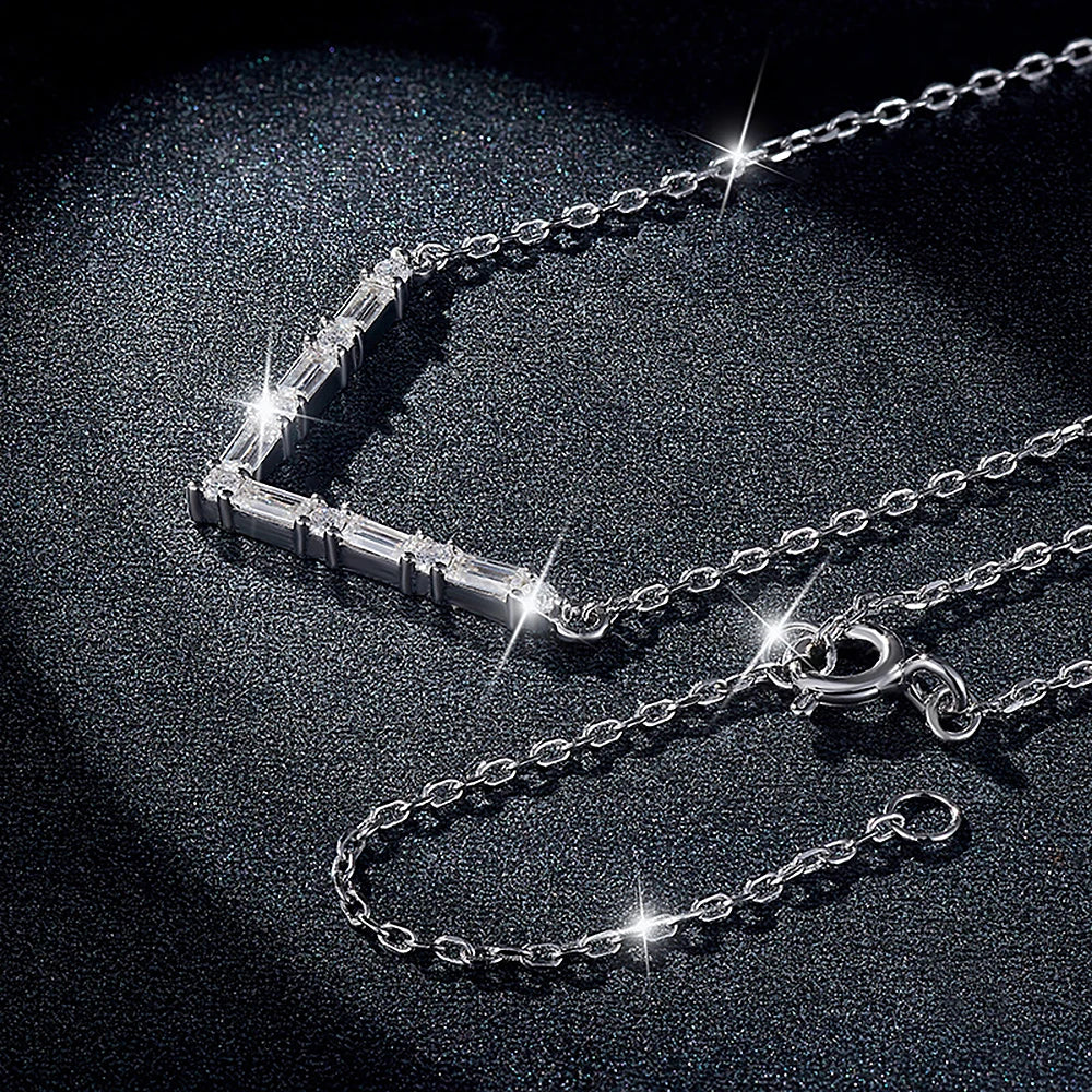 Silver necklace with a clasp on a dark background