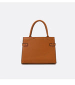 Brown leather handbag on a white background