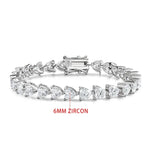 Silver bracelet with heart-shaped zircons on a white background