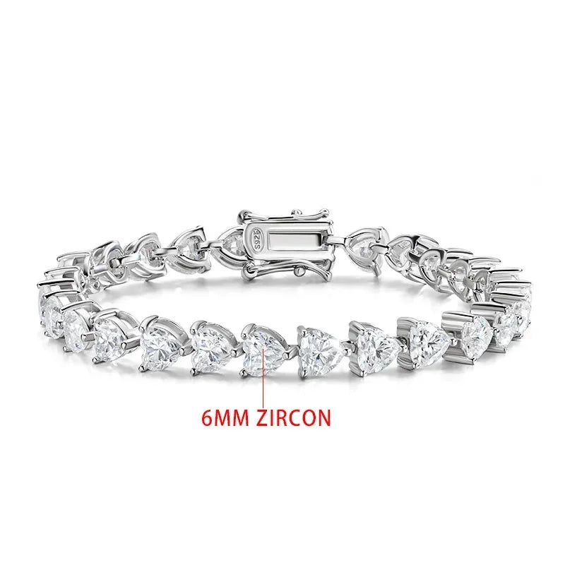 Silver bracelet with heart-shaped zircons on a white background