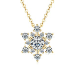 Gold necklace with a snowflake-shaped diamond pendant on a white background